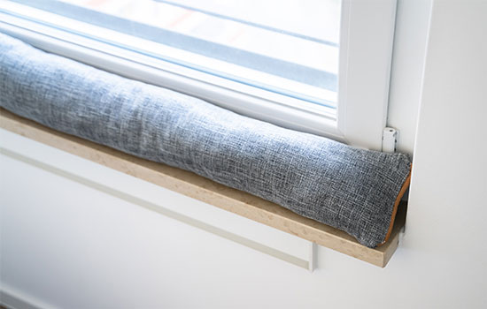 draft excluder under window blocking cold air