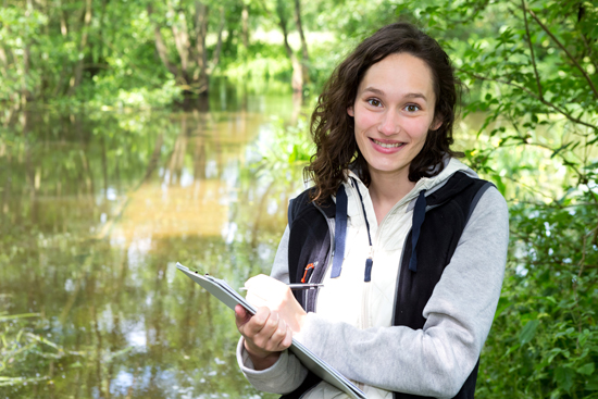 smiling woman in forest