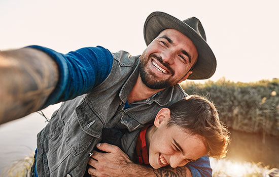 happy father and son fishing